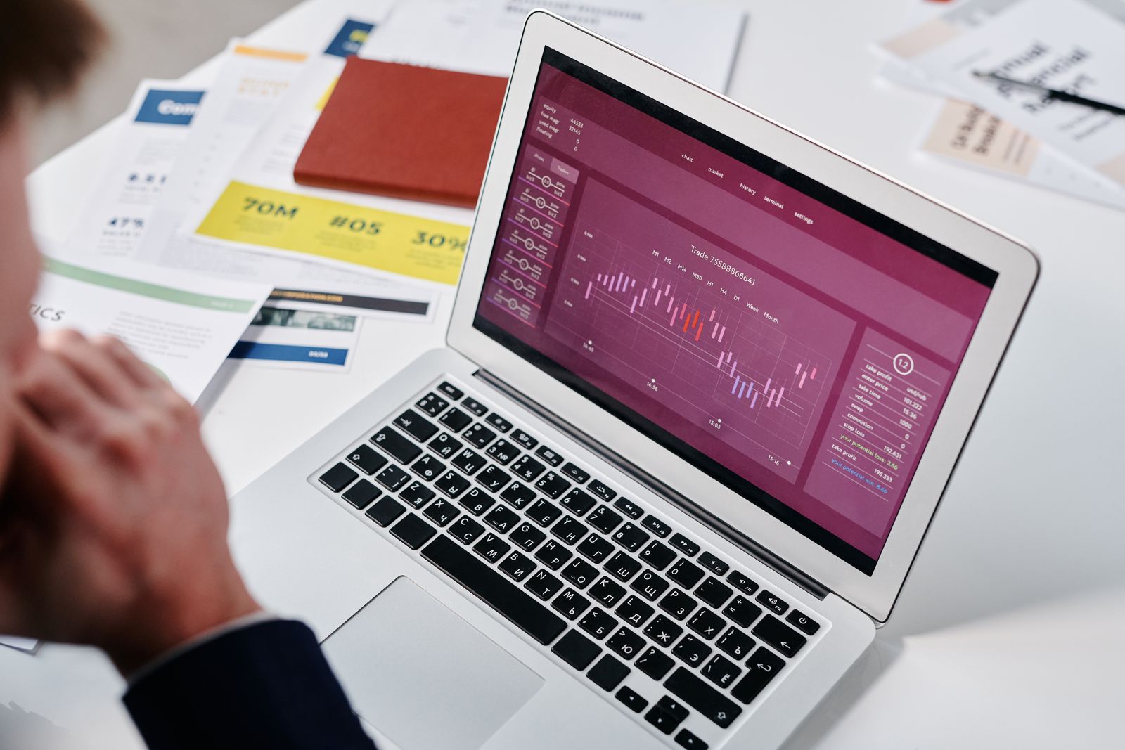 Marketing analyst reviewing impression and CPM data on a laptop to calculate basic Earned Media Value